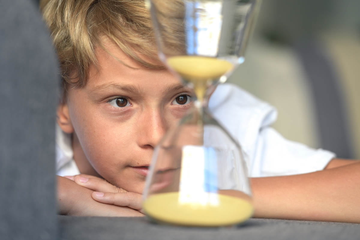 A young child intently exploring their environment